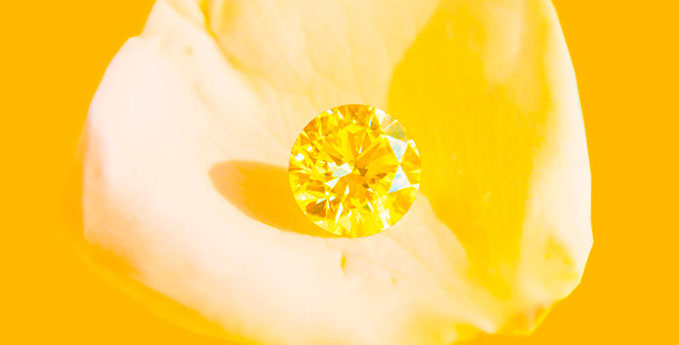 A gorgeous ff fancy intense yellow round brilliant diamond that shines like the sun.