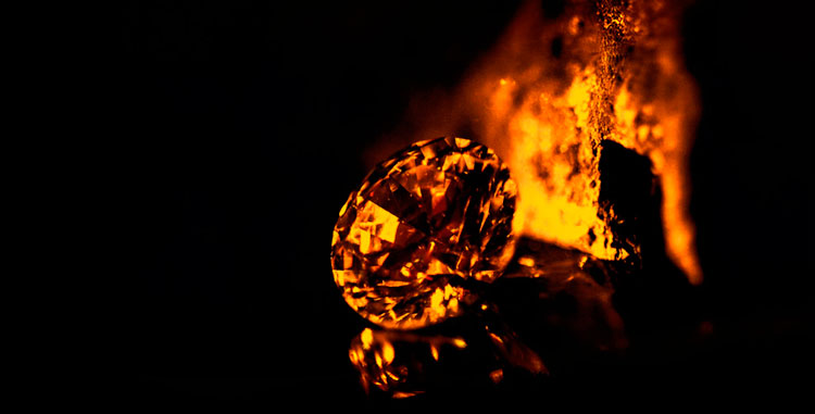 An extraordinary ff fancy gold round brilliant shaped diamond with a magic glow.